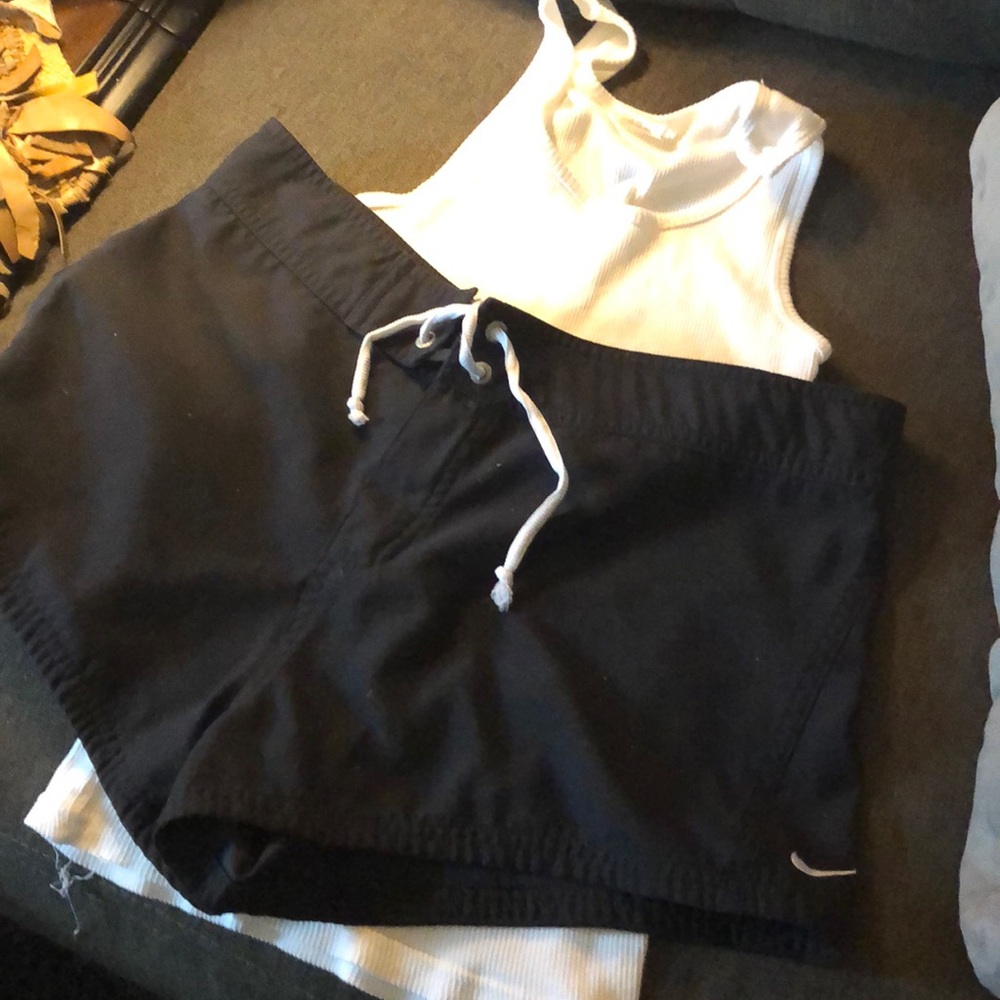 Nike swim trunks medium get free tank.